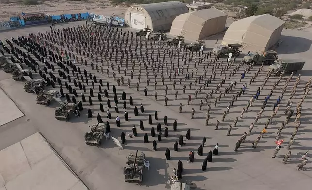 In this image provided by Sepahnews of the Iranian Revolutionary Guard on Feb. 16, 2026, shows troops standing at attention during the guard's drill in the Persian Gulf on Monday, Feb. 16, 2026. (Sepahnews via AP)