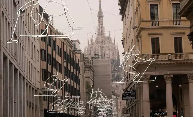 FILE - Olympic Iconic neon rings hang next to the Duomo gothic cathedral for the upcoming Milan Cortina Winter Olympics in Milan, Italy, Friday, Jan. 9, 2026. (AP Photo/Luca Bruno, File)