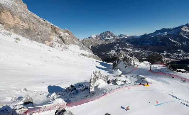 FILE - A skier trains at the Milan Cortina 2026 Winter Olympics venue in the Dolomite Mountains in Cortina d'Ampezzo, Italy, on Jan. 17, 2025. (AP Photo/Alessandro Trovati, File)