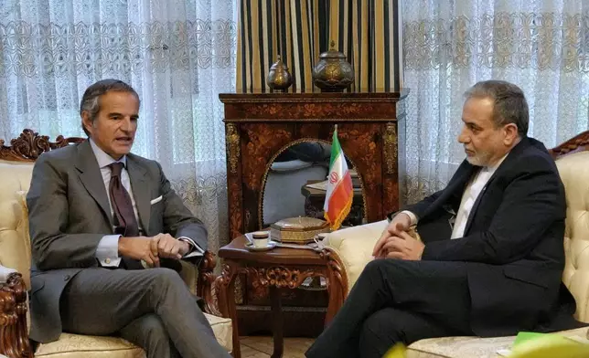 In this photo released by the Iranian Foreign Ministry, Iranian Foreign Minister Abbas Araghchi, right, and International Atomic Energy Agency (IAEA) Director-General Rafael Grossi, left, hold a meeting in Geneva, Switzerland, Monday, Feb. 16, 2026. (Iranian Foreign Ministry via AP)