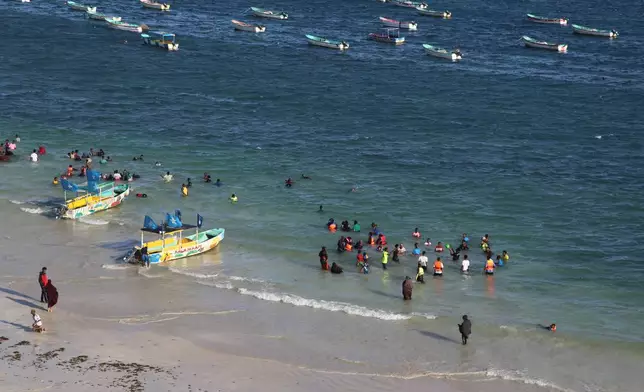 People swim at Lido Beach in Mogadishu, Somalia, on Jan. 27, 2026. (AP Photo/Farah Abdi Warsameh)
