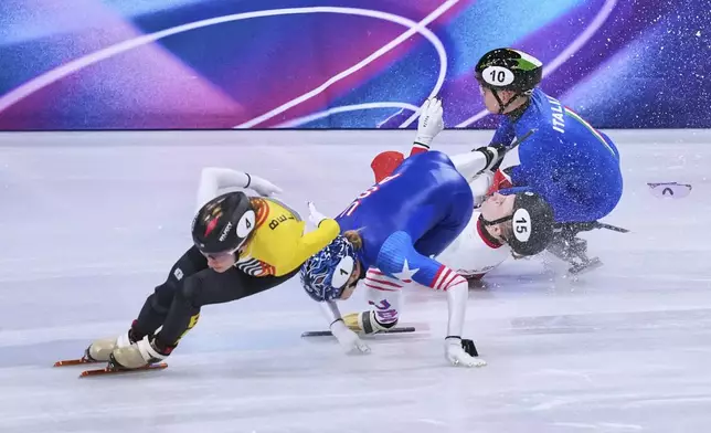 Kamila Sellier of Poland falls during the women's 1,500 meters short track speedskating quarterfinal at the 2026 Winter Olympics, in Milan, Italy, Friday, Feb. 20, 2026. (AP Photo/Stephanie Scarbrough)