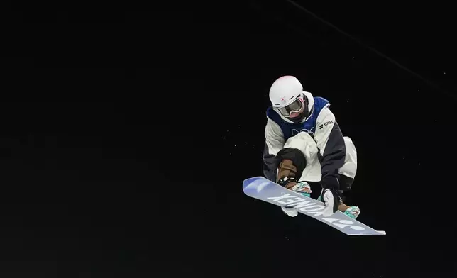 Japan's Yuto Totsuka competes during the men's snowboarding halfpipe finals at the 2026 Winter Olympics, in Livigno, Italy, Friday, Feb. 13, 2026. (AP Photo/Lindsey Wasson)