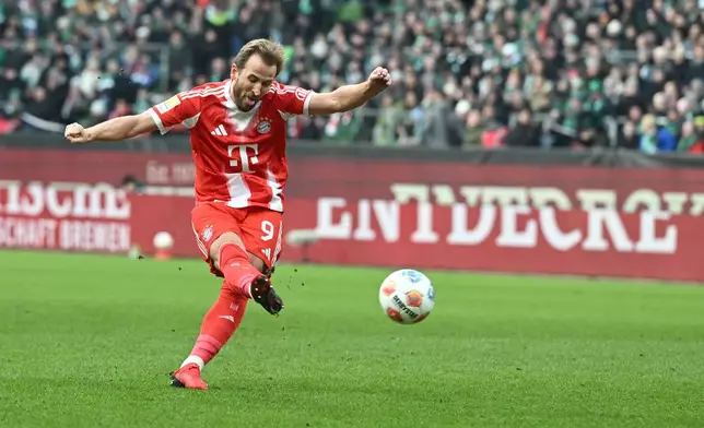 Bayern's Harry Kane scores his side's second goal during the German Bundesliga soccer match between Werder Bremen and Bayern Munich, in Bremen, Germany, Saturday, Dec. 14, 2026. (Carmen Jaspersen/dpa via AP)