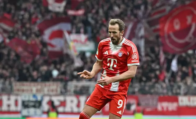 Bayern's Harry Kane celebrates after scoring his side's second goal during the German Bundesliga soccer match between Werder Bremen and Bayern Munich, in Bremen, Germany, Saturday, Dec. 14, 2026. (Carmen Jaspersen/dpa via AP)