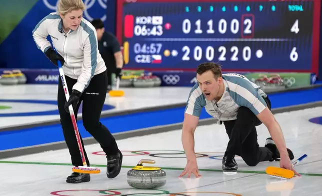Norway's Magnus Nedregotten and Kristin Skaslien in action during the mixed doubles round robin phase of the curling competition against Estonia, at the 2026 Winter Olympics, in Cortina d'Ampezzo, Italy, Saturday, Feb. 7, 2026. (AP Photo/Misper Apawu)