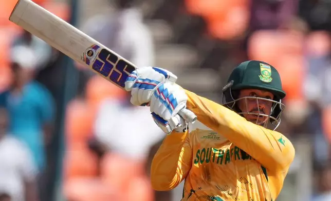 South Africa's Quinton de Kock plays a shot during the T20 World Cup cricket match between Afghanistan and South Africa in Ahmedabad, India, Wednesday, Feb. 11, 2026. (AP Photo/Ajit Solanki)