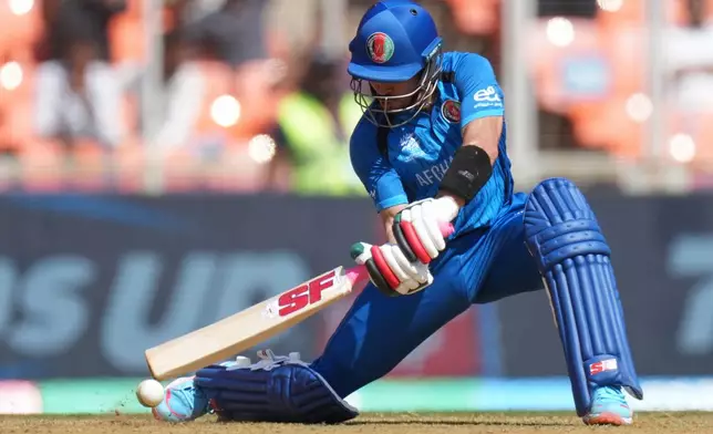 Afghanistan's Rahmanullah Gurbaz plays a shot during the T20 World Cup cricket match between Afghanistan and South Africa in Ahmedabad, India, Wednesday, Feb. 11, 2026. (AP Photo/Ajit Solanki)
