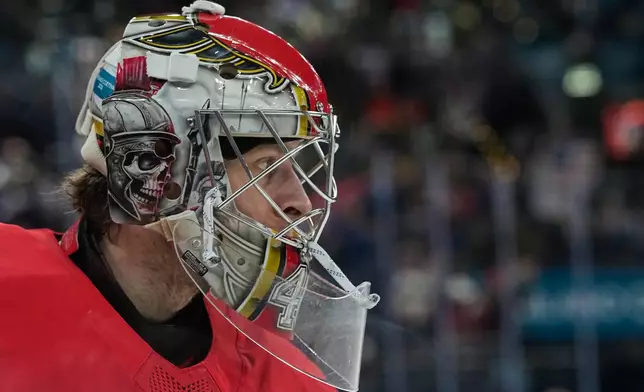 Denmark's goalkeeper Mads Sogaard looks on during a preliminary round match of men's ice hockey between United States and Denmark at the 2026 Winter Olympics, in Milan, Italy, Saturday, Feb. 14, 2026. (AP Photo/Petr David Josek)