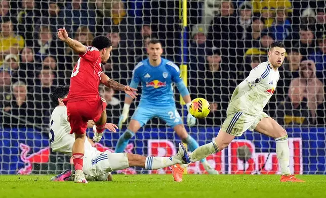 Nottingham Forest's Morgan Gibbs-White, front, attempts a shot on goal during the English Premier League soccer match between Leeds United and Nottingham Forest in Leeds, England, Friday Feb. 6, 2026. (Danny Lawson/PA via AP)