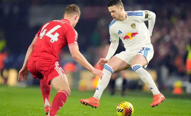 Leeds United's Gabriel Gudmundsson, right, controls the ball as Nottingham Forest's Zach Abbott moves in during the English Premier League soccer match between Leeds United and Nottingham Forest in Leeds, England, Friday Feb. 6, 2026. (Danny Lawson/PA via AP)