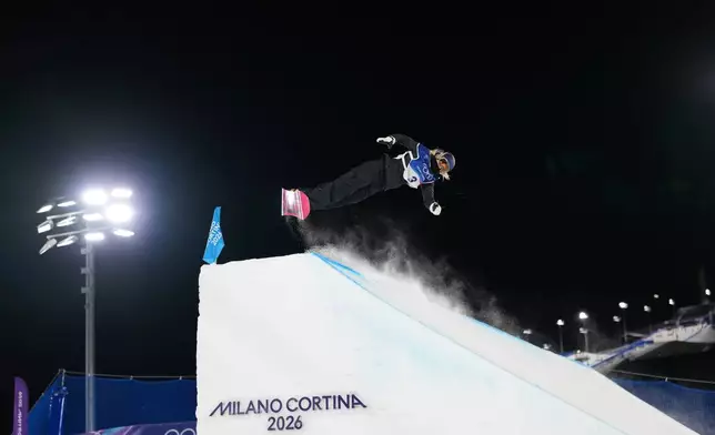 Austria's Anna Gasser competes during the women's snowboard big air qualifications at the 2026 Winter Olympics, in Livigno, Italy, Sunday, Feb. 8, 2026. (AP Photo/Abbie Parr)