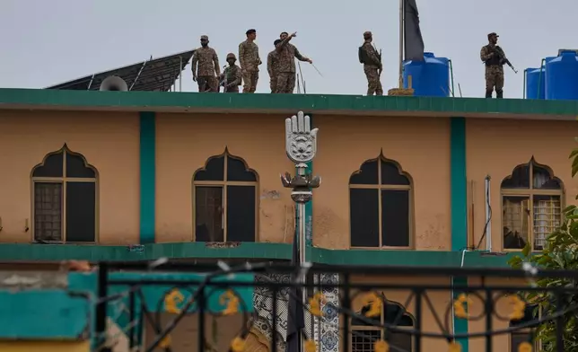 Army officials examine the site of a bomb explosion at a Shiite mosque, in Islamabad, Pakistan, Friday, Feb. 6, 2026. (AP Photo/Anjum Naveed)