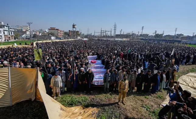 Mourners attend funeral prayer of the victims of Friday suicide bombing inside a Shiite mosque, in Islamabad, Pakistan, Saturday, Feb. 7, 2026. (AP Photo/Anjum Naveed)