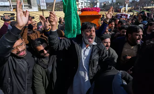 Mourners shout slogans as they carry coffin of a victim of Friday's suicide bombing inside a Shiite mosque, for a funeral prayer, in Islamabad, Pakistan, Saturday, Feb. 7, 2026. (AP Photo/Anjum Naveed)
