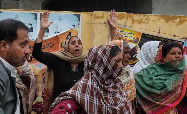 A woman mourns over the death of her relative, close to the site of a bomb explosion at a Shiite mosque, in Islamabad, Pakistan, Friday, Feb. 6, 2026. (AP Photo/Anjum Naveed)