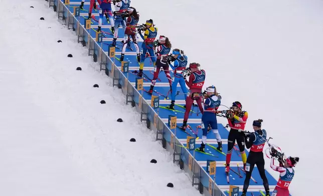 Athletes compete in the women's 4x6-kilometer relay biathlon race at the 2026 Winter Olympics in Anterselva, Italy, Wednesday, Feb. 18, 2026. (AP Photo/Mosa'ab Elshamy)