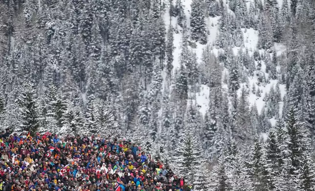 Spectators wait for the start of the women's 4x6-kilometer relay biathlon race at the 2026 Winter Olympics in Anterselva, Italy, Wednesday, Feb. 18, 2026. (AP Photo/Mosa'ab Elshamy)