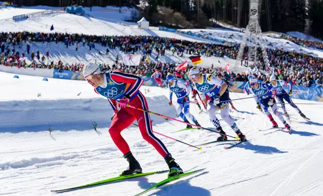 Johannes Hoesflot Klaebo, of Norway, competes in the cross-country skiing men's team sprint free at the 2026 Winter Olympics, in Tesero, Italy, Wednesday, Feb. 18, 2026. (AP Photo/Evgeniy Maloletka)