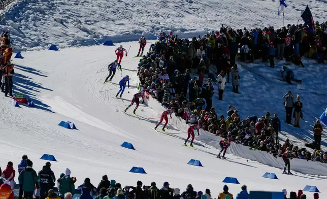 Alison Mackie, of Canada, Nadja Kaelin, of Switzerland, and Astrid Oeyre Slind, of Norway, from right, compete in the cross-country skiing women's team sprint free at the 2026 Winter Olympics, in Tesero, Italy, Wednesday, Feb. 18, 2026. (AP Photo/Matthias Schrader)