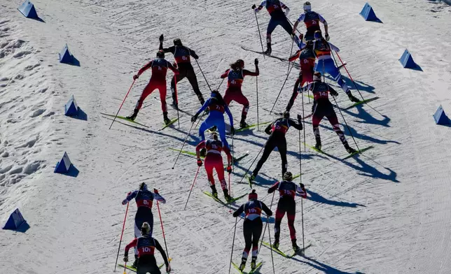 Athletes compete in the cross-country skiing women's team sprint free at the 2026 Winter Olympics, in Tesero, Italy, Wednesday, Feb. 18, 2026. (AP Photo/Matthias Schrader)