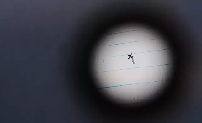 Japan's Reira Iwabuchi competes during the women's snowboarding slopestyle finals at the 2026 Winter Olympics, in Livigno, Italy, Wednesday, Feb. 18, 2026. (AP Photo/Lindsey Wasson)