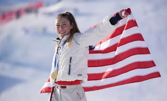 United States' Mikaela Shiffrin celebrates winning the gold medal in an alpine ski, women's slalom race, at the 2026 Winter Olympics, in Cortina d'Ampezzo, Italy, Wednesday, Feb. 18, 2026. (AP Photo/Jacquelyn Martin)