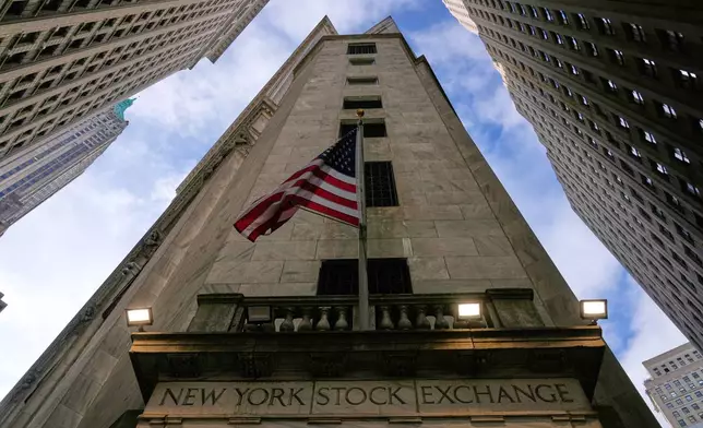 An American flag is displayed over an entrance to the New York Stock Exchange in New York, Thursday, Feb. 12, 2026. (AP Photo/Seth Wenig)