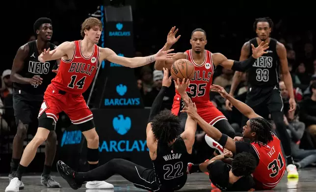 Brooklyn Nets forward Jalen Wilson (22) attempts to pass away during the first half of an NBA basketball game against the Chicago Bulls, Monday, Feb. 9, 2026, in New York. (AP Photo/Yuki Iwamura)