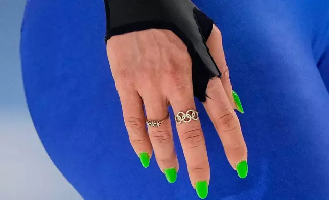 Francesca Lollobrigida of Italy wears the Olympics Rings on a ring in the women's 1500 meters speedskating race at the 2026 Winter Olympics, in Milan, Italy, Friday, Feb. 20, 2026. (AP Photo/Ben Curtis)