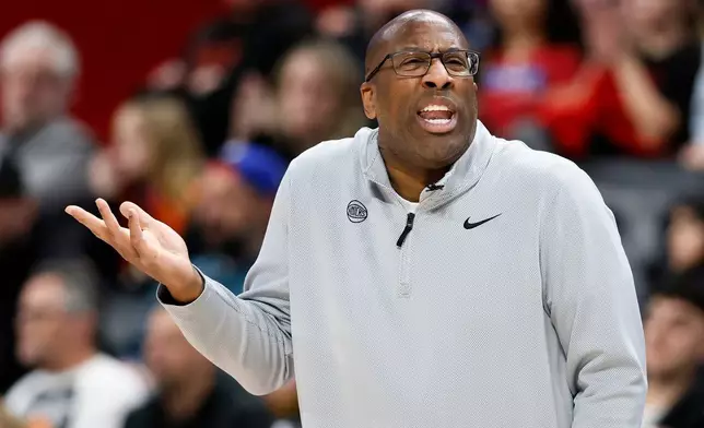 New York Knicks head coach Mike Brown gestures to an official after his team was whistled for a foul during the second half of an NBA basketball game against the Detroit Pistons, Friday, Feb. 6, 2026, in Detroit. (AP Photo/Duane Burleson)