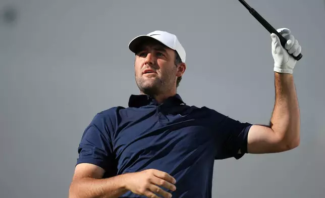 Scottie Scheffler watches his tee shot at the 17th hole during the first round of the Phoenix Open golf tournament at the TPC Scottsdale Stadium Course Thursday, Feb. 5, 2026, in Scottsdale, Ariz. (AP Photo/Ross D. Franklin)