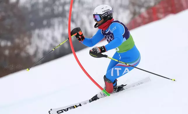Italy's Giada d'Antonio competes in an alpine ski, women's slalom portion of a team combined race, at the 2026 Winter Olympics, in Cortina d'Ampezzo, Italy, Tuesday, Feb. 10, 2026. (AP Photo/Jacquelyn Martin)