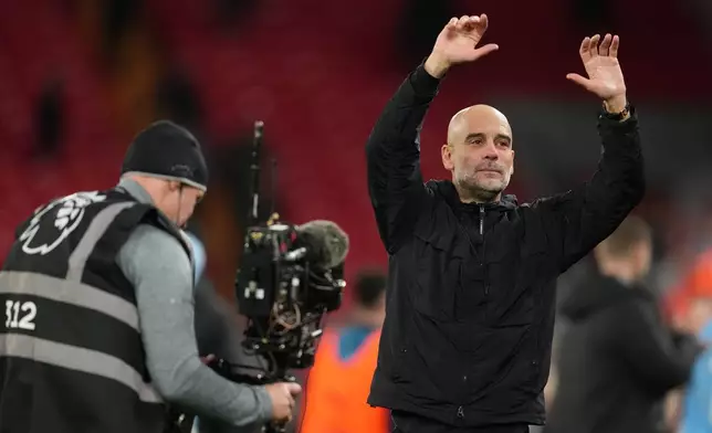 Manchester City's head coach Pep Guardiola reacts after the English Premier League soccer match between Liverpool and Manchester City in Liverpool, England, Sunday, Feb. 8, 2026. (AP Photo/Jon Super)