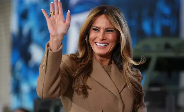 First lady Melania Trump arrives before President Donald Trump speaks to soldiers and their families at Fort Bragg, N.C., Friday, Feb. 13, 2026. (AP Photo/Matt Rourke)