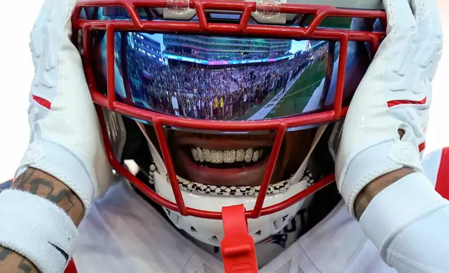 New England Patriots wide receiver DeMario Douglas warms up before the NFL Super Bowl 60 football game Seattle Seahawks, Sunday, Feb. 8, 2026, in Santa Clara, Calif. (AP Photo/Julio Cortez)