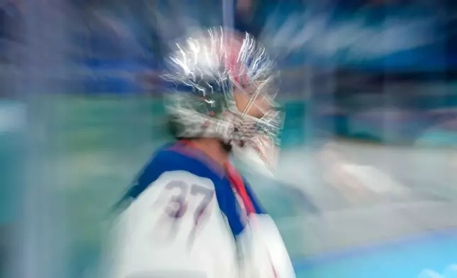 United States' Connor Hellebuyck warms up before a men's ice hockey semifinal game between the United States and Slovakia at the 2026 Winter Olympics, in Milan, Italy, Friday, Feb. 20, 2026. (AP Photo/Hassan Ammar)