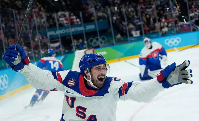 United States' Dylan Larkin (21) celebrates after scoring the opening goal during a men's ice hockey semifinal game between United States and Slovakia at the 2026 Winter Olympics, in Milan, Italy, Friday, Feb. 20, 2026. (AP Photo/Petr David Josek)