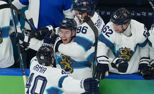 Finland's Erik Haula (56) celebrates after scoring a goal against Canada during the second period of a men's ice hockey semifinal game at the 2026 Winter Olympics in Milan, Italy, Friday, Feb. 20, 2026. (AP Photo/Carolyn Kaster)