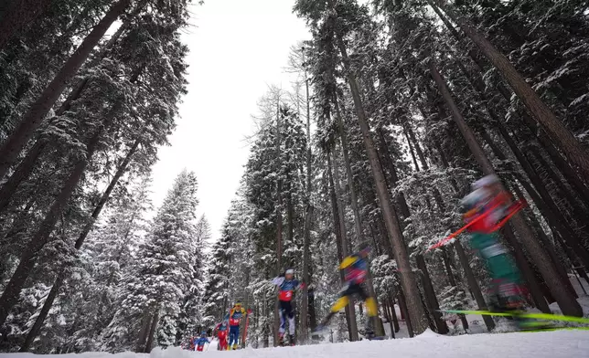 Athletes compete in the men's 4x7.5-kilometer relay biathlon race at the 2026 Winter Olympics in Anterselva, Italy, Tuesday, Feb. 17, 2026. (AP Photo/Andrew Medichini)