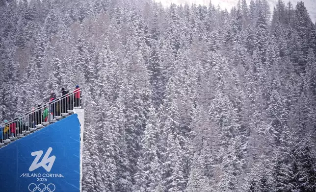 Spectators watch the men's 4x7.5-kilometer relay biathlon race at the 2026 Winter Olympics in Anterselva, Italy, Tuesday, Feb. 17, 2026. (AP Photo/Andrew Medichini)