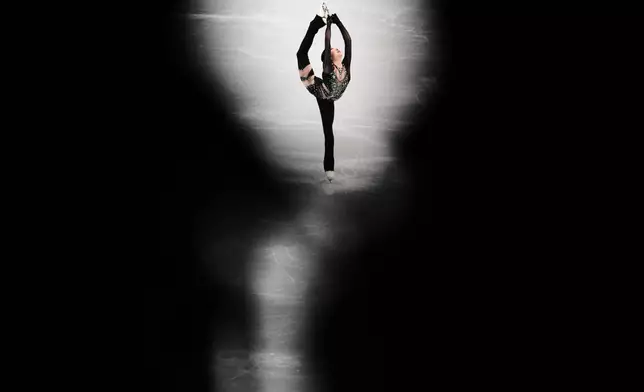 Zhang Ruiyang of China competes during the women's short program figure skating at the 2026 Winter Olympics, in Milan, Italy, Tuesday, Feb. 17, 2026. (AP Photo/Francisco Seco)