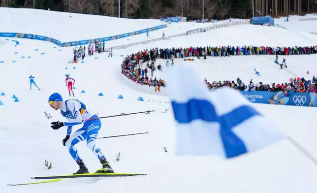 Ilkka Herola, of Finland, competes in the nordic combined individual Gundersen large hill/10km at the 2026 Winter Olympics, in Tesero, Italy, Tuesday, Feb. 17, 2026. (AP Photo/Evgeniy Maloletka)