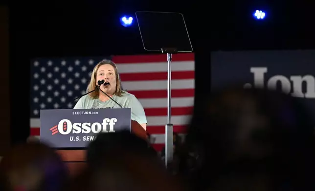 Teresa Acosta, Affordable Care Act (ACA) recipient, speaks before U.S. Sen. Jon Ossoff takes on the stage during "Rally for Our Republic with U.S. Senator Jon Ossoff" at the Georgia International Convention Center, Saturday, Feb. 7, 2026, in College Park, Ga. (Hyosub Shin/Atlanta Journal-Constitution via AP)