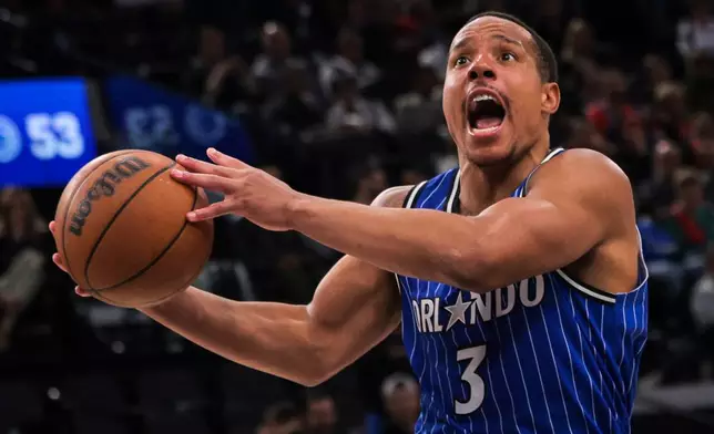 Orlando Magic guard Desmond Bane scores during the first half of a NBA basketball game against the Los Angeles Clippers, Sunday, Feb. 22, 2026, in Inglewood, Calif. (AP Photo/Etienne Laurent)
