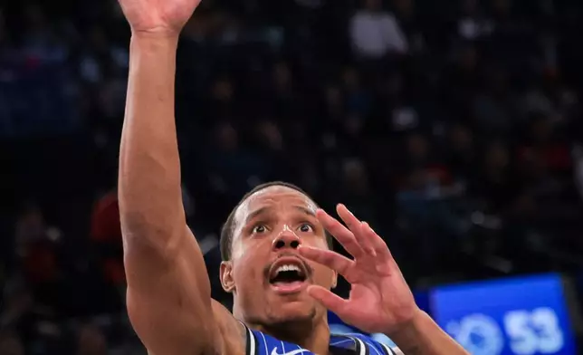 Orlando Magic guard Desmond Bane scores during the first half of a NBA basketball game against the Los Angeles Clippers, Sunday, Feb. 22, 2026, in Inglewood, Calif. (AP Photo/Etienne Laurent)