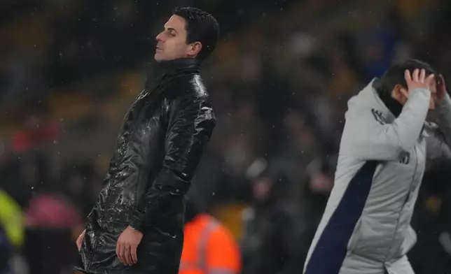 Arsenal's manager Mikel Arteta reacts during the Premier League soccer match between Wolverhampton Wanderers and Arsenal in Wolverhampton, England, Wednesday, Feb. 18, 2026. (AP Photo/Dave Shopland)