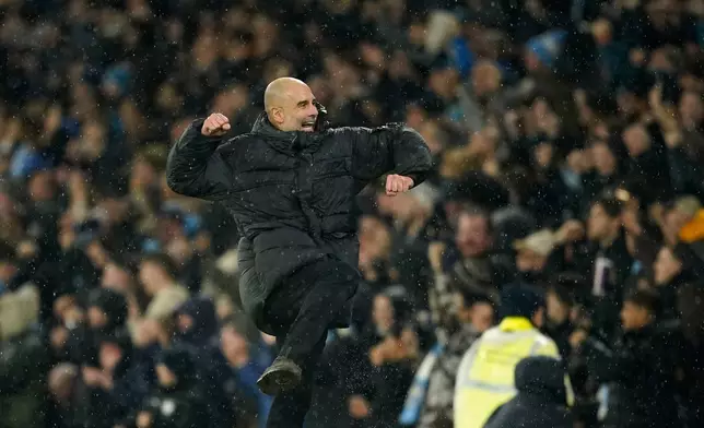 Manchester City's head coach Pep Guardiola celebrates after Manchester City's Erling Haaland scoring his side's third goal during the English Premier League soccer match between Manchester City and Fulham in Manchester, England, Wednesday, Feb. 11, 2026. (AP Photo/Dave Thompson)