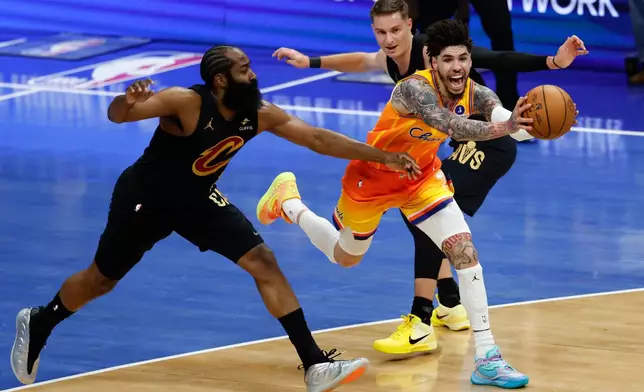 Charlotte Hornets guard LaMelo Ball, front right, drives between Cleveland Cavaliers guards James Harden, left, and Sam Merrill, back right, during the first half of an NBA basketball game in Charlotte, N.C., Friday, Feb. 20, 2026. (AP Photo/Nell Redmond)