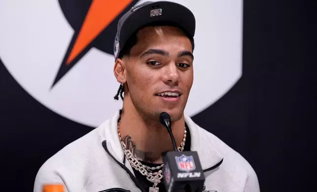 New England Patriots cornerback Christian Gonzalez speaks during the NFL Super Bowl Opening Night, Monday, Feb. 2, 2026, in San Jose, Calif. ahead of the Super Bowl 60 football game between the New England Patriots and the Seattle Seahawks. (AP Photo/Godofredo A. Vásquez)
